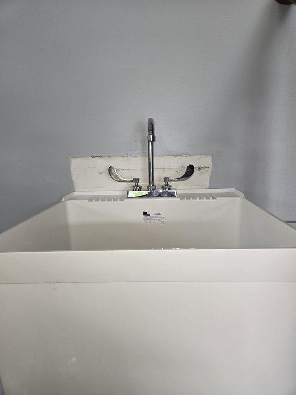 Replaced worn faucet cartridges on commercial utility sink to restore proper water flow and temperature control. Removed old corroded cartridges and installed new replacement cartridges with fresh O-ring seals, completing the quoted repair work.