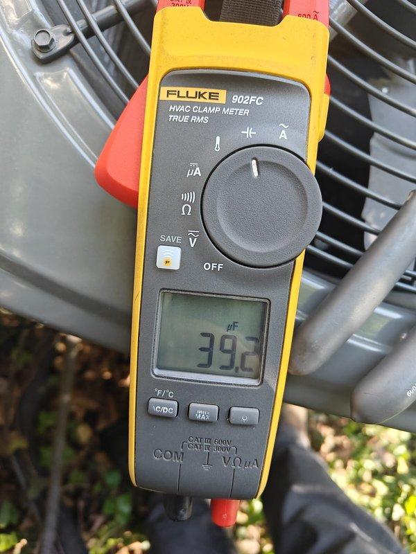 Completed 2026 cooling season first service maintenance on residential HVAC system. Performed comprehensive inspection of outdoor condensing unit, measuring capacitor values using Fluke 902FC clamp meter with readings of 39μF and 43μF recorded to verify proper compressor and fan motor operation. Unit operational with normal parameters observed.