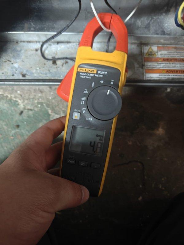 Completed 2026 cooling season first service maintenance on residential HVAC system. Performed comprehensive inspection of outdoor condensing unit, measuring capacitor values using Fluke 902FC clamp meter with readings of 39μF and 43μF recorded to verify proper compressor and fan motor operation. Unit operational with normal parameters observed.