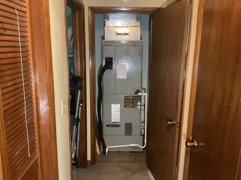 Conducted comprehensive assessment of existing HVAC system for complete heat pump and air handler replacement estimate. Evaluated current equipment configuration in residential utility closet, documenting existing air handler unit and ductwork installation. Inspected attic space to assess ductwork conditions, insulation coverage, and accessibility for replacement installation. Provided estimate for complete system replacement including heat pump, air handler, and Halo air purification system, with additional recommendation for mold remediation services to be performed by qualified subcontractor prior to equipment installation.