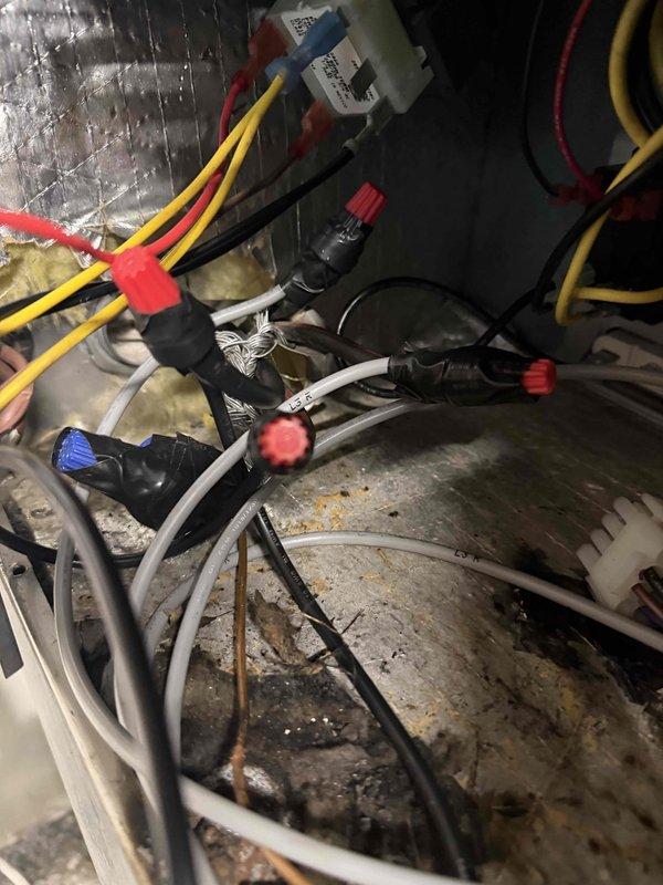 Responded to no cooling call with reported breaker tripping and dead thermostat on 10+ year old unit. Upon arrival, confirmed power issues and performed diagnostic inspection of HVAC system. Opened air handler compartment and found blower assembly with significant dirt and dust accumulation, indicating lack of regular maintenance. Inspected electrical components including capacitor, wiring connections, and associated hardware within the unit. Proceeded to main electrical panel and tested amperage draw, recording 23.36 amps on the affected circuit using clamp meter to verify electrical load and identify potential overcurrent condition causing breaker trips. Documented system condition with photos showing contaminated blower wheel and electrical measurements. Advised customer of diagnostic findings and discussed repair options for aging equipment experiencing electrical and operational failures.