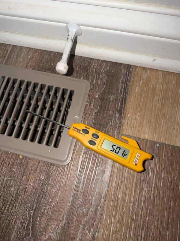 Completed scheduled cooling maintenance inspection on residential HVAC system. Verified thermostat operation and calibration, confirmed proper temperature readings at supply register measuring 50°F, indicating adequate cooling system performance. All equipment functioning within normal parameters.