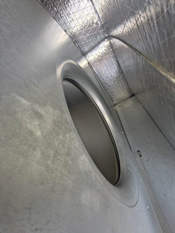 Completed comprehensive cooling maintenance inspection on residential HVAC system. Inspected supply register grilles and verified proper airflow distribution throughout the living space. Examined ductwork system in attic space, including insulated flexible ducting and sheet metal trunk line with metallic reflective insulation, confirming all connections are secure and insulation is intact with no visible air leakage points.