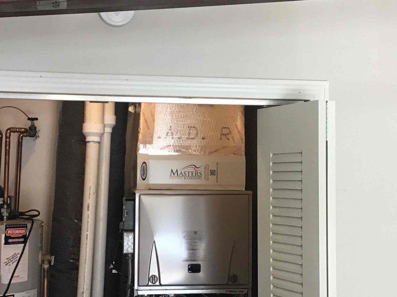 Completed full HVAC system installation in utility closet including new heating and cooling equipment. Installed all necessary refrigerant lines, condensate drainage with PVC piping, and copper supply lines with shutoff valves. Mounted equipment access panel and ensured proper clearances for service access through louvered door opening.