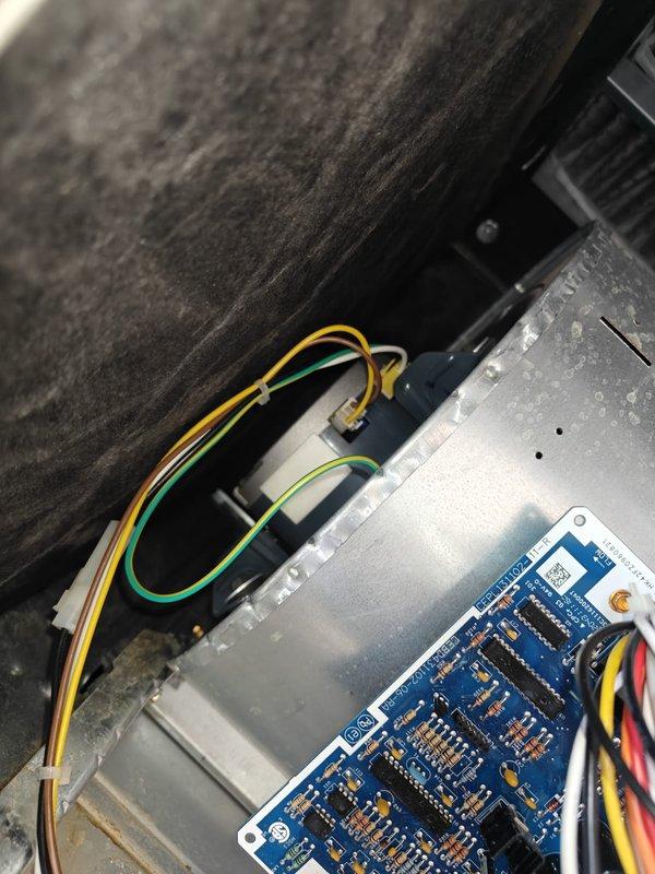 Completed comprehensive cooling maintenance on residential HVAC system including dehumidifier service and filter replacement. Performed standard maintenance protocol including inspection of blower motor assembly, electrical connections, and control board functionality. Verified system temperatures using calibrated digital thermometer, recording supply air temperature of 90.8°F. Inspected interior components including motor windings, wiring harnesses, and PCB for proper operation and signs of wear. Checked all electrical connections to blower motor and control board, ensuring secure terminations of yellow, green, white, red, and black wire leads. Examined insulation integrity throughout air handler cabinet. Replaced air filter as part of routine maintenance schedule. Serviced dehumidifier unit per manufacturer specifications. All components found operating within normal parameters with no deficiencies noted. System tested and left in proper working condition.