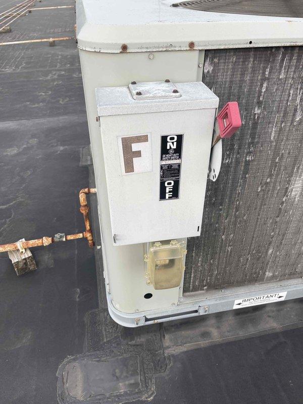 Conducted site assessment of three rooftop units (RTUs) at commercial retail facility to provide replacement estimates as requested by property management. Inspected all three units, documented existing equipment conditions including weathered casings, electrical disconnects labeled "E" and "F", and noted significant corrosion on copper refrigerant and gas lines. Photographed equipment showing age-related deterioration and confirmed rooftop access for future replacement work.