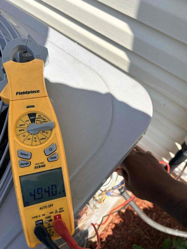 Completed scheduled cooling maintenance on outdoor condensing unit. Performed system diagnostics and electrical measurements, recording voltage readings of 120.0V and amperage of 49.40A, with supply air temperature measured at 93.6°F. Verified proper electrical operation, inspected refrigerant line connections, and confirmed system operating within normal parameters; customer-supplied filter available on-site for replacement.