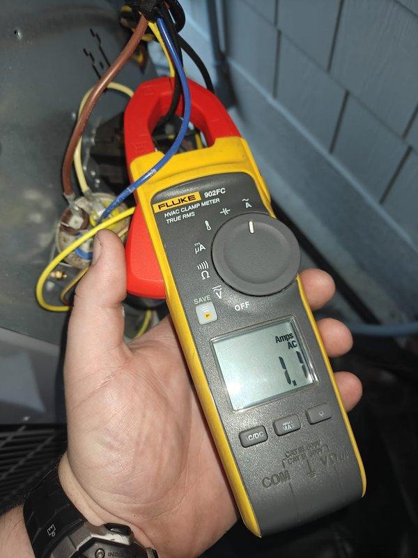 Completed cooling system tune-up and maintenance inspection. Performed amperage readings on system components using clamp meter, recording compressor draw at 4.4 amps and blower motor current at 1.1 amps, both within manufacturer specifications. Inspected electrical connections, control board, and wiring harnesses for proper operation and secure terminations. System operating normally with all measurements indicating proper function.