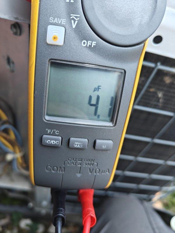 Completed comprehensive air conditioning tune-up and system inspection. Performed thorough examination of blower motor assembly and electrical connections, verifying all wire terminals and multi-conductor wiring were secure and properly connected. Tested system capacitor using digital multimeter, measuring capacitance at 4 microfarads to ensure proper motor operation and starting capabilities. Inspected interior components for normal wear and dust accumulation, confirmed blower motor mounting and housing integrity, and verified all mechanical and electrical components operating within manufacturer specifications.