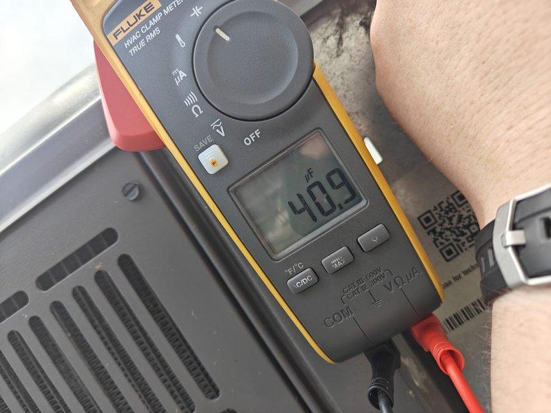 Completed first cooling season maintenance on residential HVAC system. Performed comprehensive inspection of evaporator coil, noting minor dust accumulation on aluminum fins but overall good condition with no significant debris buildup or damage to coil assembly. Tested system capacitance using calibration-grade meter, recording 40.9 µF reading to verify proper electrical component operation and ensure optimal compressor performance for the cooling season.