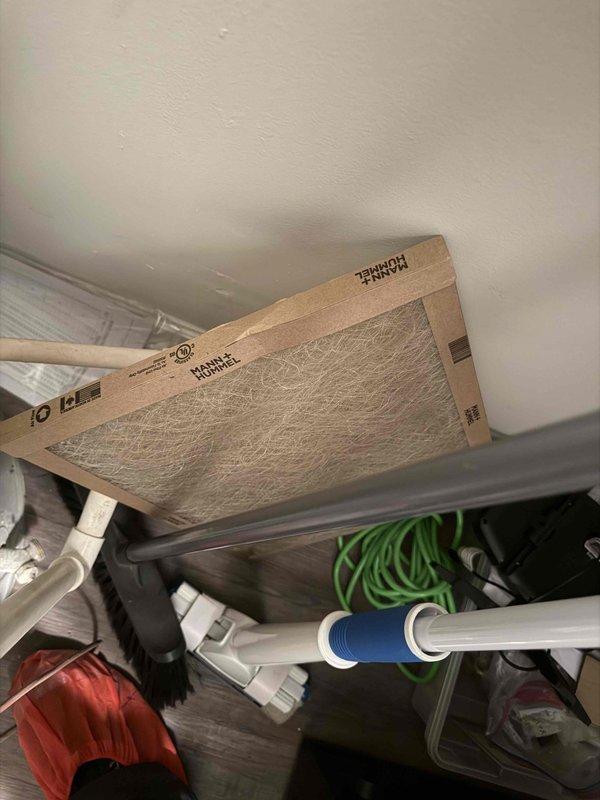 # No Cooling Complaint - Recent Installation

Responded to no cooling call on 4-month-old system. Upon arrival, confirmed unit would not operate when thermostat called for cooling. Removed access panel and performed diagnostic testing using digital multimeter. 

Testing revealed 28.2-volt reading at blower motor assembly, indicating low voltage issue preventing proper system operation. Inspected all wire connections at motor housing and control board, noting proper routing secured with mounting clips. Traced electrical circuit through system components to identify source of voltage drop.

Checked air filter condition and found standard residential filter in place with adequate airflow. Verified refrigerant line connections and pressure gauge assembly at service ports showed no signs of refrigerant loss or system leaks.

Corrected low voltage condition at motor circuit. Cycled system through complete startup sequence and verified proper operation of all components. Unit now cooling norm