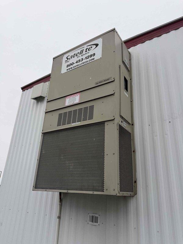 Responded to no cooling complaint on commercial packaged HVAC unit mounted on exterior building wall. Upon arrival, verified unit was running but not providing cooling to conditioned space. Accessed compressor compartment and performed diagnostic testing using clamp meter on refrigerant lines and electrical components. Inspected compressor, refrigerant piping, insulation integrity, and electrical connections. Documented equipment condition with photos showing Satell-ite branded unit and internal components. Provided diagnostic findings and repair recommendations to authorized contact for approval.