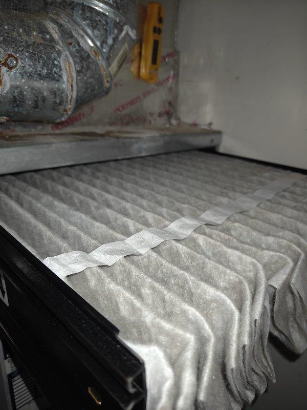 Completed comprehensive AC tune-up including full system inspection and diagnostics. Tested capacitor with multimeter, reading 44 microfarads within acceptable range for proper compressor operation. Inspected air filtration system, noting pleated filter condition and ductwork connections, with all components functioning properly and system operating efficiently.