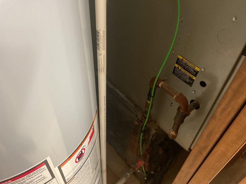 Completed comprehensive estimate for full HVAC system replacement on residential property with 15+ year old equipment. Assessed existing furnace/air handler unit located in interior mechanical closet with standard gas line and electrical connections, and outdoor condensing unit positioned on base pad against exterior wall. System has reached end of serviceable life expectancy and requires complete replacement including indoor air handling equipment, outdoor condensing unit, refrigerant lines, electrical connections, and associated components to restore efficient heating and cooling operation.