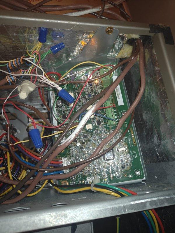 Completed comprehensive tune-up on heat pump system, including inspection of control board and electrical connections within the unit housing. Performed capacitance testing using digital multimeter, measuring 390 nF on system capacitor to verify proper operation. All components inspected and found operating within normal parameters.