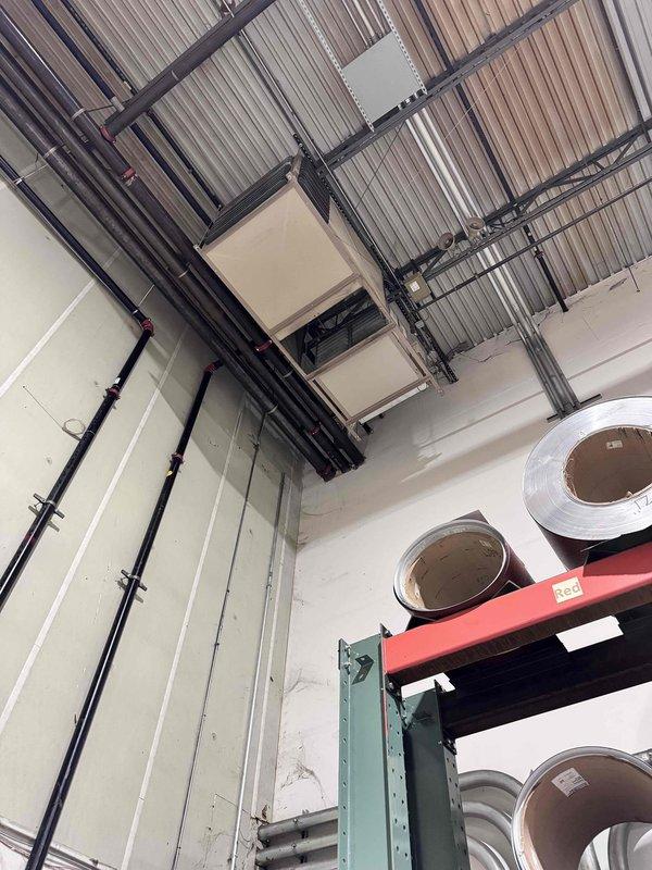 Completed initial heating maintenance service on commercial HVAC system as part of annual maintenance agreement. Performed comprehensive inspection of overhead-mounted air handling unit, documented equipment specifications, and recorded belt and filter sizes for future service visits. System operating within normal parameters; photographed equipment location and configuration for service records.