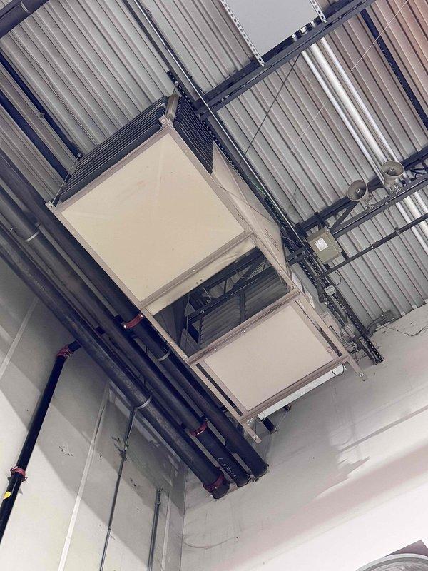 Completed initial heating maintenance service on commercial HVAC system as part of annual maintenance agreement. Performed comprehensive inspection of overhead-mounted air handling unit, documented equipment specifications, and recorded belt and filter sizes for future service visits. System operating within normal parameters; photographed equipment location and configuration for service records.