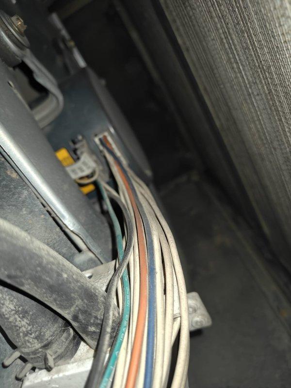 Responded to cooling system maintenance call regarding reported water accumulation on floor following previous service visits. Performed thorough inspection of evaporator coil, condensate drain system, and drain pan assembly. Verified evaporator coil temperature at 63°F and examined all electrical connections and wiring harness for proper operation. Inspected condensate drain lines and PVC piping for blockages or improper drainage that could cause water overflow. Documented internal components and drainage system configuration to identify source of water leakage issue.