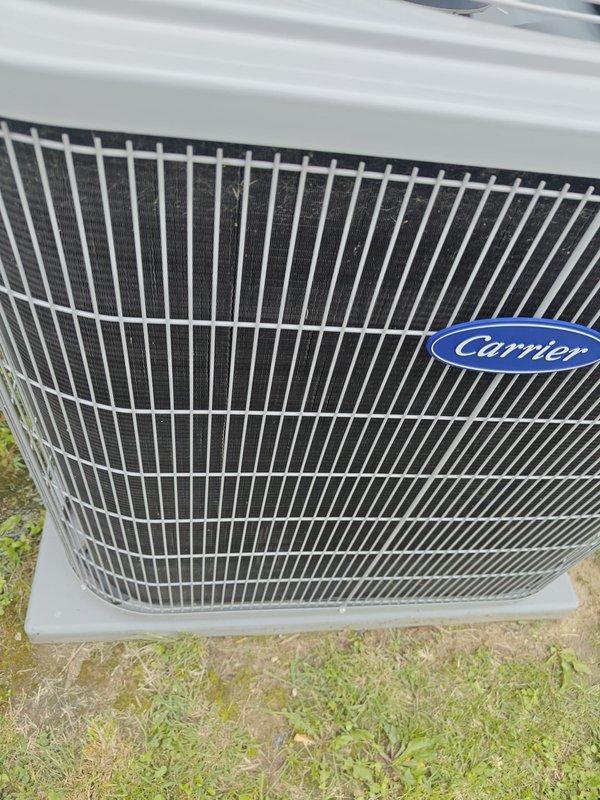 Completed scheduled cooling maintenance on Carrier outdoor condensing unit. Performed comprehensive system inspection including electrical testing with digital multimeter confirming proper voltage at 12.1V, checked refrigerant levels, inspected condenser coil and fan operation, and verified unit functionality. All components operating within normal parameters with no issues identified.
