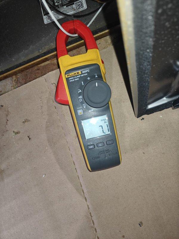 Performed comprehensive AC tune-up on residential air conditioning system. Conducted electrical diagnostics using digital clamp meter, measuring capacitance readings of 4.18 μF and 7.1 μF on system components to verify proper operation. Completed standard preventive maintenance procedures on outdoor condenser unit to ensure optimal system performance for the cooling season.