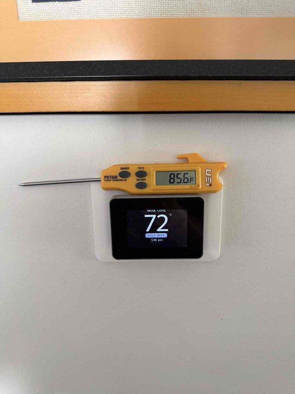 Responded to reported thermostat malfunction with erratic temperature display readings and sudden fluctuations between 74°F and 68°F. Upon arrival, performed diagnostic evaluation of thermostat operation and verified temperature accuracy using calibrated digital thermometer, which revealed a 7-degree variance between thermostat display reading and actual ambient temperature. Documented thermostat displaying inconsistent readings and confirmed system operational issues requiring thermostat calibration or replacement to restore proper HVAC system control.
