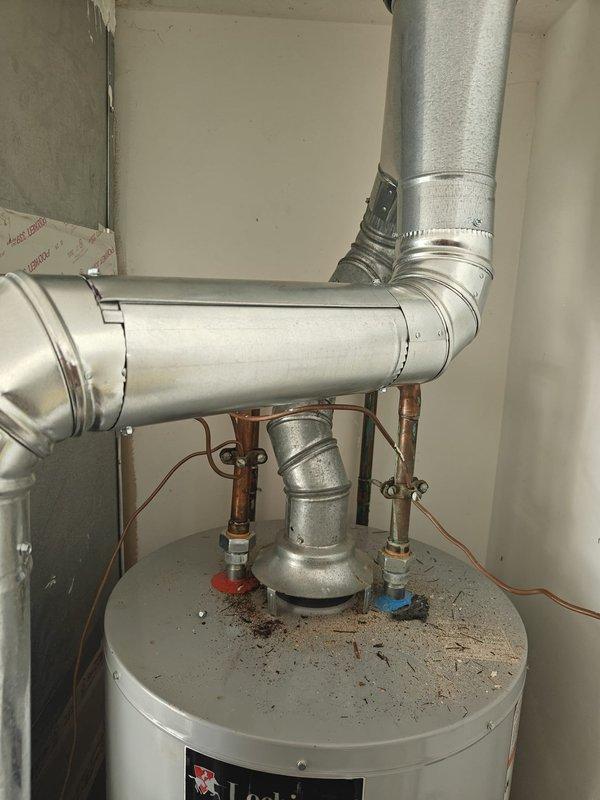 Completed previously quoted repairs on water heater system. Inspected and evaluated capacitor condition, provided pricing for replacement as requested, and proceeded with capacitor replacement upon approval. Verified proper operation of copper piping connections, shut-off valves, and galvanized vent pipe assembly to ensure system functionality and safety compliance.