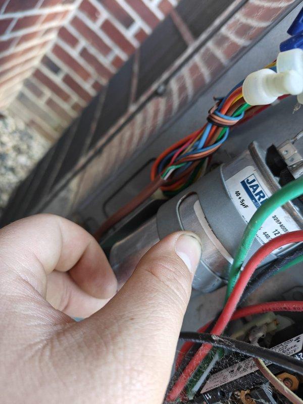 Completed comprehensive air conditioning maintenance and tune-up for new customer referral. Performed thorough cleaning of outdoor condenser unit with particular attention to removing cottonwood debris buildup, verified electrical connections and low-voltage control wiring, and conducted amperage draw testing using clamp meter which confirmed system operating within normal parameters at 0.9 amps AC.