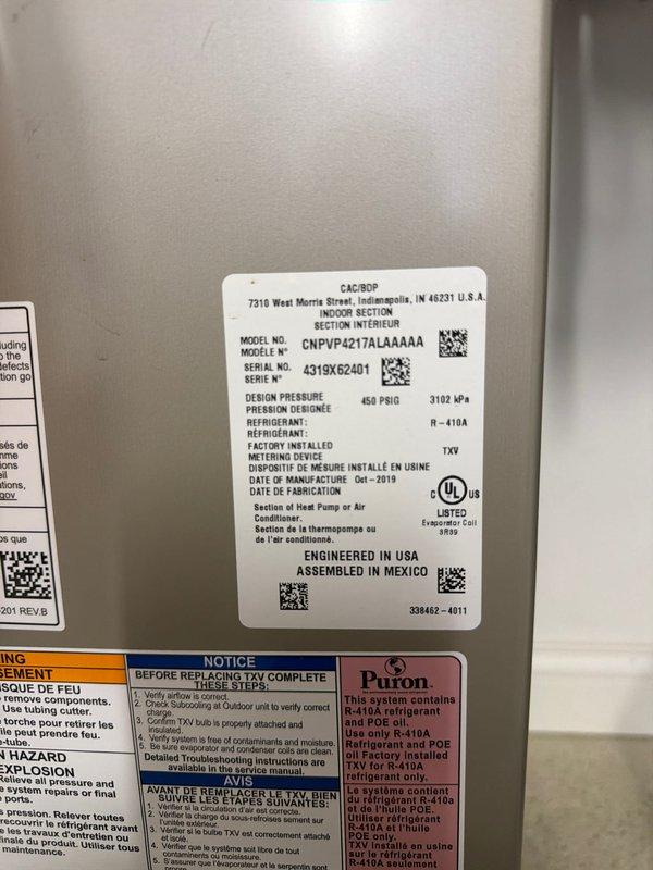 Completed first cooling season maintenance on heat pump system model CNPVP4217ALAAAAA utilizing R-410A refrigerant. Performed comprehensive inspection of indoor air handler unit, verified proper motor operation and electrical connections, and documented equipment specifications and serial number for service records. All system components inspected and found operating within normal parameters.