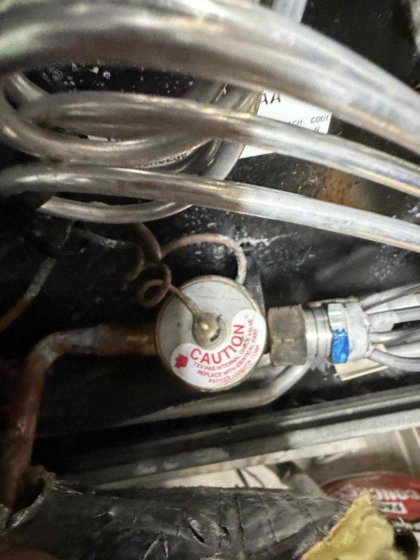 Completed comprehensive tune-up on residential heat pump system. Performed standard maintenance procedures including inspection of indoor air handler unit, refrigerant line set, pressure relief components, and filter drier assembly. All components found operating within normal parameters with proper labeling and code compliance verified.
