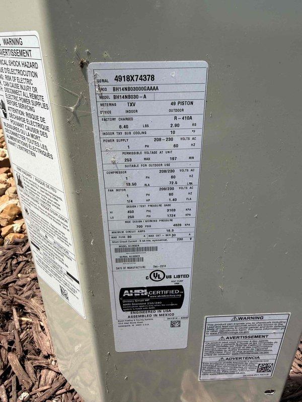 Responded to service call for outdoor condensing unit with reported fan failure. Upon arrival, inspected Goodman heat pump model BH14N0B0000GAAA (serial number 4918X74378) located on ground-level gravel pad against building exterior. Verified fan motor operation, checked electrical connections at unit, and confirmed proper power supply to condensing unit. Documented equipment condition and verified system returned to normal operation with fan running properly.