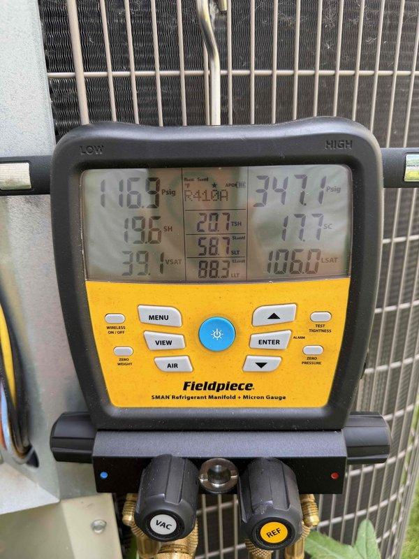 Responded to no cooling call on R410A system. Performed diagnostic testing using refrigerant manifold gauge to measure system pressures and temperatures. High side pressure reading of 347.7 PSIG and low side pressure of 118.7 PSIG indicated potential system issues. Superheat measurements of 19.6°F and 20.1°F were recorded on both lines. Saturation temperatures measured at 39.1°F on low side and 106.0°F on high side. Conducted electrical testing on condenser unit capacitor using multimeter, which displayed a reading of 4.1 microfarads. Based on diagnostic findings, provided customer with repair options and recommendations for restoring proper cooling operation to the system.
