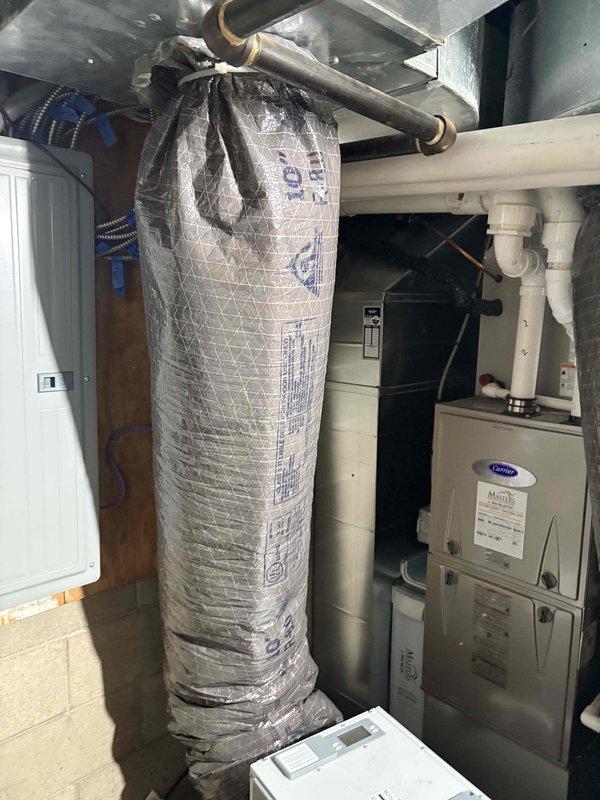 Responded to callback request to reconnect whole-house dehumidifier in mechanical room. Completed all electrical and condensate drain connections to unit, verified proper mounting and ductwork integration with existing Carrier HVAC system. Tested unit operation and confirmed proper drainage through PVC trap assembly, system now fully operational.