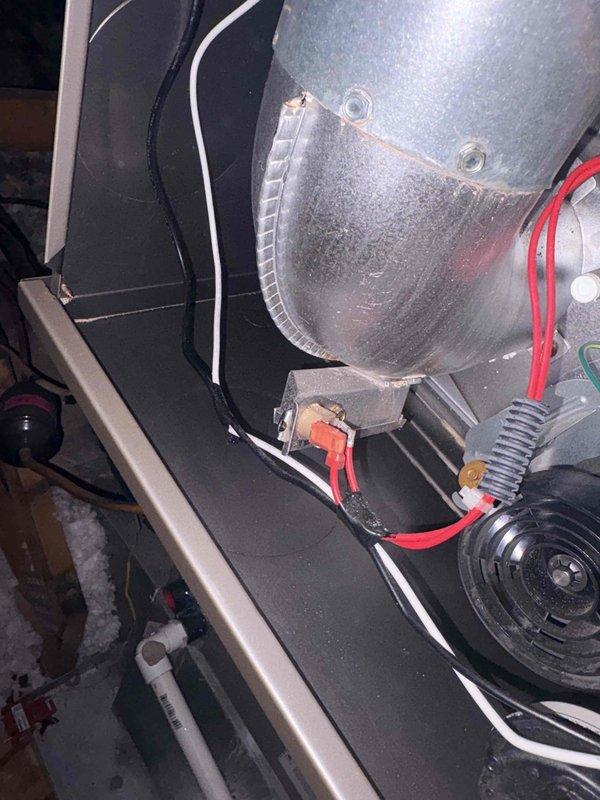 Performed pre-sale furnace and air conditioning system inspection as requested. Inspected blower motor assembly, electrical connections, and control wiring for proper operation and safety compliance. Secured furnace unit and plenum box mounting per inspection requirements. Cleaned furnace cabinet interior, removing debris and dust accumulation. Replaced air filter with new pleated filter to ensure proper airflow. Documented equipment condition with photos showing blower assembly, motor components, and low-voltage wiring connections. Provided recommendations for additional securing work needed to meet inspection standards.