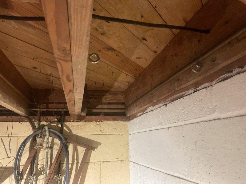 Conducted comprehensive assessment of residential HVAC system and existing water heater installation in basement mechanical room to provide replacement estimate. Evaluated current copper piping configuration, ductwork system with reflective insulation, and mechanical equipment mounted to concrete block walls and floor joists. Documented existing infrastructure including plumbing connections, gas lines, electrical conduit, and ventilation requirements to determine scope of replacement work and equipment specifications needed for complete system upgrade.