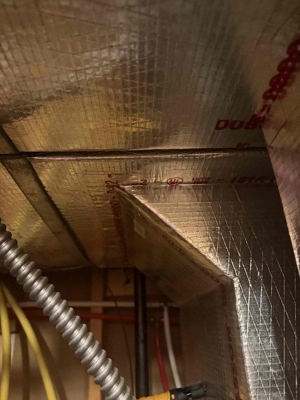 Responded to no cooling call on unit over 10 years old. Customer reported frozen evaporator coil and had turned system off prior to arrival. Upon inspection, accessed attic-mounted air handler and documented insulation condition and ductwork routing. Performed diagnostic evaluation of system freeze-up condition, taking measurements and photos of affected components and surrounding installation for assessment and customer records.