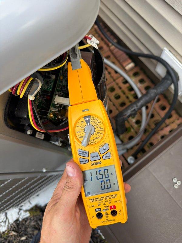 Completed scheduled cooling maintenance on HVAC system. Performed comprehensive electrical diagnostics using clamp meter, measuring amperage draw and voltage readings on system components. Inspected internal wiring, bus bars, and capacitor connections within air handler unit. All electrical parameters tested within normal operating range at 115V. Noted pre-existing water damage and corrosion on auxiliary heating elements and surrounding baseboard area, with visible rust staining on walls and flooring near piping. System operational and cooling function verified upon completion of maintenance protocol.