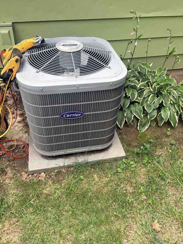 Performed annual cooling maintenance on Carrier air conditioning system and diagnosed inadequate cooling complaint. Installed 16x20x4 filter at indoor air handler and conducted comprehensive system inspection. Measured electrical parameters at indoor unit using digital multimeter, recording voltage reading of 23.7V during diagnostic testing. Inspected outdoor condenser unit positioned on concrete pad, verifying proper placement and clearance from landscaping. Evaluated condenser coil condition, refrigerant lines, and overall system operation to identify cooling deficiency cause and restore optimal performance.