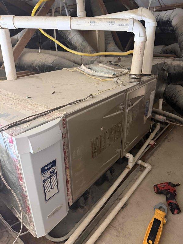 Responded to service call for non-operational unit and performed monthly AC maintenance. Upon arrival, conducted system inspection of air handler unit located in attic space. Accessed internal components through service panel to evaluate refrigerant lines, valve assembly, and connection points. Noted brass four-way valve connector with bundled refrigerant lines secured with proper clamps and insulation intact.

Per customer request and previous service notes, utilized portable power washer to thoroughly clean exterior condenser coil, removing accumulated dirt, debris, and organic material that can restrict airflow and reduce cooling efficiency. Verified all PVC drainage lines and condensate connections at air handler for proper flow and secure attachment. Inspected electrical connections, including conduit routing and power supply integrity.

Completed standard maintenance procedures including filter inspection, blower assembly evaluation, and verification of all manufacturer specifica