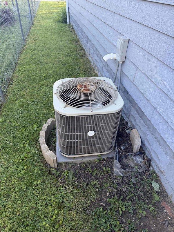 Responded to no cooling complaint on 10+ year old outdoor condensing unit where indoor temperature was reaching 80's. Upon inspection, diagnosed failed run capacitor (TITAN PRO brand) in condensing unit, which was preventing compressor from operating efficiently. Replaced defective capacitor with new unit, verified proper electrical connections, tested system operation, and confirmed unit now cooling properly with temperature dropping to desired setpoint.