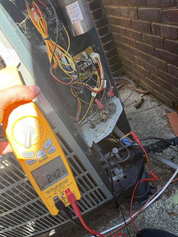 Responded to no-cooling call where indoor blower was operating but outdoor unit failed to run. Upon arrival, performed electrical diagnostics on the outdoor condensing unit and measured 24.2 volts at the control board, confirming proper low-voltage signal from thermostat. However, noted extensive corrosion and rust throughout the indoor air handler cabinet, affecting multiple internal components including the evaporator coil assembly, blower housing, and metal framework. The severe deterioration of the indoor unit indicates prolonged exposure to moisture and compromised cabinet integrity. Outdoor unit electrical components were tested and found to be receiving proper voltage. The widespread corrosion observed in the indoor unit suggests potential refrigerant leaks, drainage issues, or cabinet seal failures that have allowed moisture intrusion over time. Documented system condition with photos showing the extent of internal component degradation. Provided customer with findings and reco