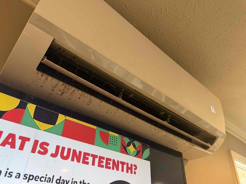 Responded to no cool complaint on LG mini-split system in operations building. Upon inspection, found evidence of significant condensation and moisture accumulation on indoor air handler unit, indicating drainage issue affecting system performance. Addressed condensate drain blockage to restore proper cooling operation.