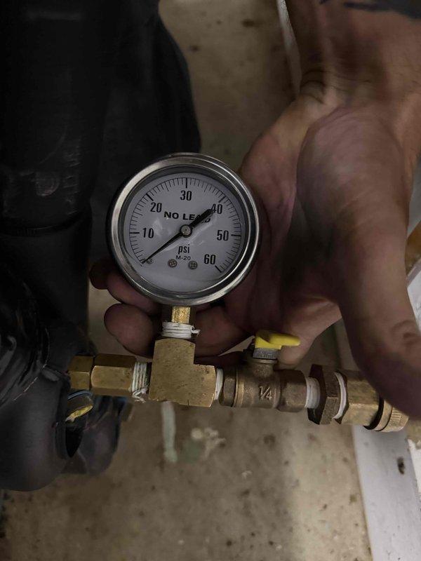 Completed first cooling maintenance service on multiple geothermal systems across two properties, including units servicing ground level, garage, shop, and laundry room areas. Performed diagnostic testing with pressure gauge readings and electrical measurements using clamp meter on system control boards to verify proper operation. All systems inspected and found operating within normal parameters following routine maintenance procedures.
