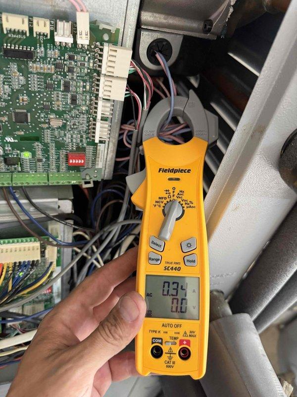 Completed first cooling maintenance service on multiple geothermal systems across two properties, including units servicing ground level, garage, shop, and laundry room areas. Performed diagnostic testing with pressure gauge readings and electrical measurements using clamp meter on system control boards to verify proper operation. All systems inspected and found operating within normal parameters following routine maintenance procedures.
