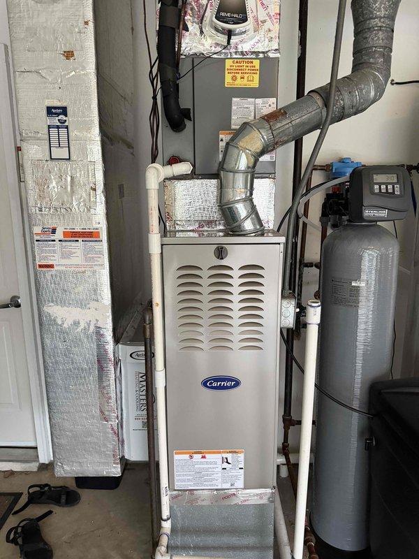 Responded to service call for residential HVAC system with damaged PVC condensate drain components. Replaced compromised section of drain line including male adapter, street 90 elbow fitting, and short pipe section to restore proper drainage function and prevent potential water damage to the mechanical room.
