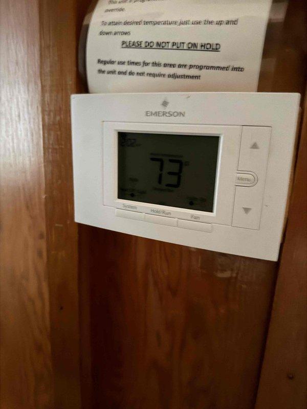 Responded to no cooling call for west wing units at commercial facility. Upon arrival, contacted customer via landline as requested. Inspected thermostat showing 73°F setpoint and measured supply air temperature at 55°F from affected units. Diagnosed cooling system operation and identified issues preventing proper temperature control in west wing zone.
