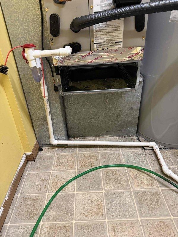 Responded to callback for water leak on recently installed HVAC system. Upon arrival, inspected air handler unit and condensate drain system. Found condensate drain line improperly pitched, preventing proper drainage and causing water accumulation. Corrected PVC drain line configuration, ensuring proper slope for gravity drainage. Verified condensate pump operation and tested system under cooling mode to confirm water is draining correctly through drain line without leaks. Unit now operating properly with no water leakage detected.