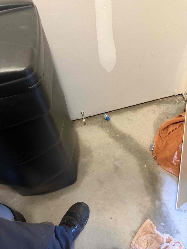 Responded to reported water softener leak on a repeat service call. Upon inspection, verified proper installation and leveling of PVC discharge piping using precision measuring equipment. Documented site conditions and plumbing configuration with photographic evidence to determine leak source and assess whether issue resulted from installation defect or external factors affecting the system.