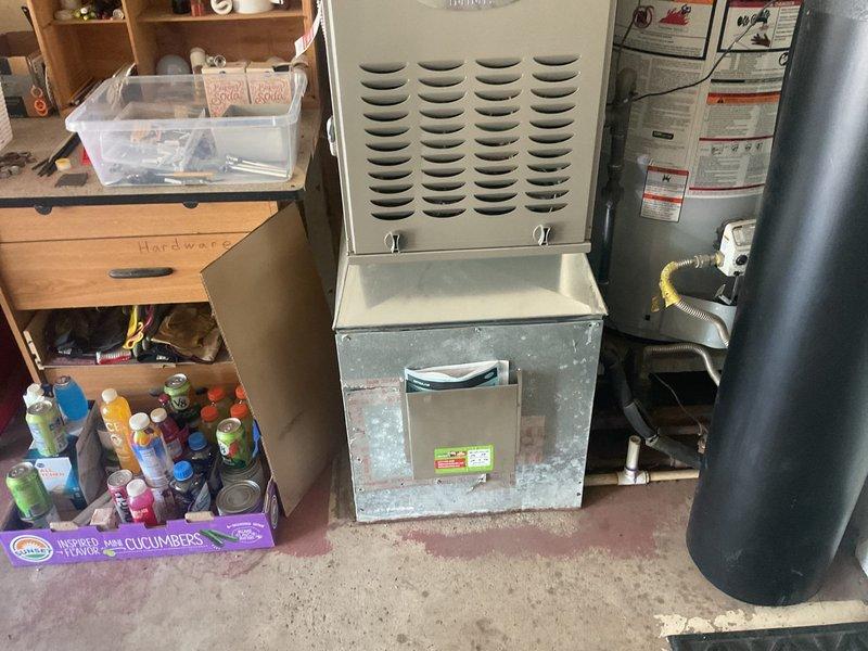 Conducted initial consultation with new customer for complete HVAC system replacement. Evaluated existing equipment including furnace and air handler unit in basement utility area, documented current programmable thermostat set to auto mode at 77°F, and assessed installation requirements for new system replacement.