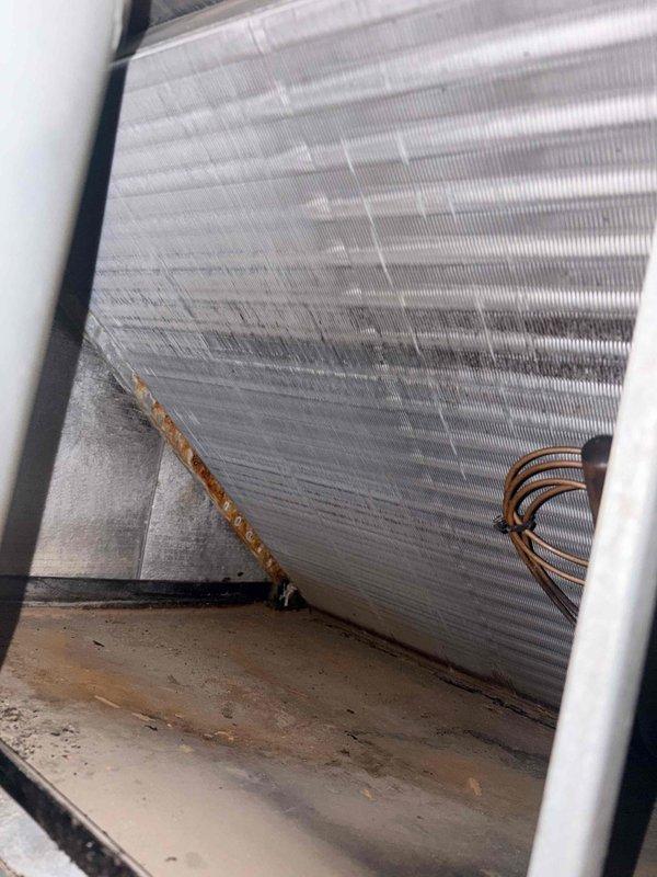 Completed first seasonal cooling maintenance on residential air conditioning system. Performed comprehensive inspection of outdoor condenser unit and indoor evaporator coil, verifying proper operation of all components including fan motor, compressor, and refrigerant lines. All aluminum fins on evaporator coil found clean with proper spacing, copper refrigerant tubing secure with no visible leaks or damage, and condenser unit operating within normal parameters with adequate airflow through louvers and protective grille.