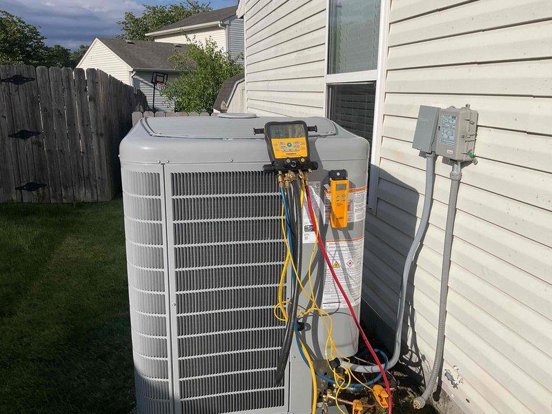 Completed full system installation of new air conditioning condenser unit and evaporator coil at residential property. Installed outdoor condensing unit on pad adjacent to home exterior, mounted new evaporator coil in basement utility area with proper ductwork connections to existing plenum system. Performed complete system startup, charged refrigerant lines to manufacturer specifications, and conducted diagnostic testing using gauge manifold to verify proper pressures, temperatures, and system operation across all components.